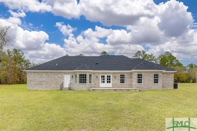127 Winding Way Rd, Pembroke, GA 31321 - rear view of property with a yard, brick siding, a patio, and roof with shingles