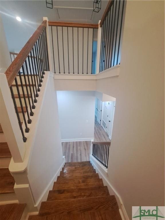 stairway featuring hardwood / wood-style flooring