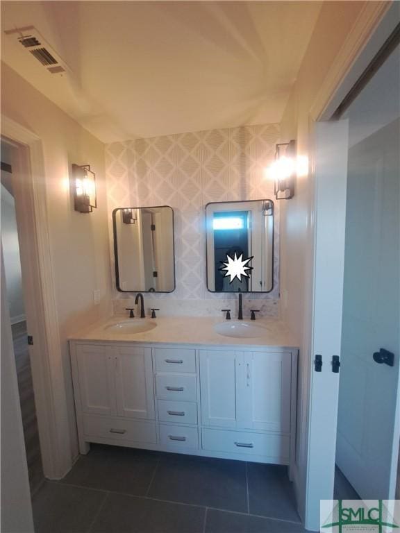 bathroom featuring tile patterned flooring and vanity