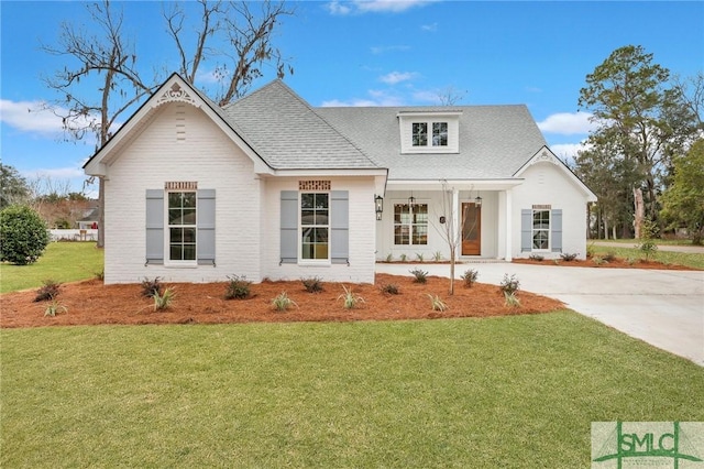 modern inspired farmhouse with a front yard