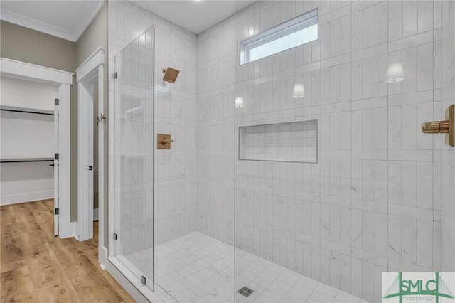 bathroom featuring hardwood / wood-style flooring and a shower with shower door