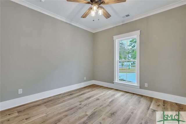 spare room with light hardwood / wood-style floors, ceiling fan, and ornamental molding