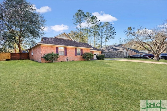 view of side of home with a lawn