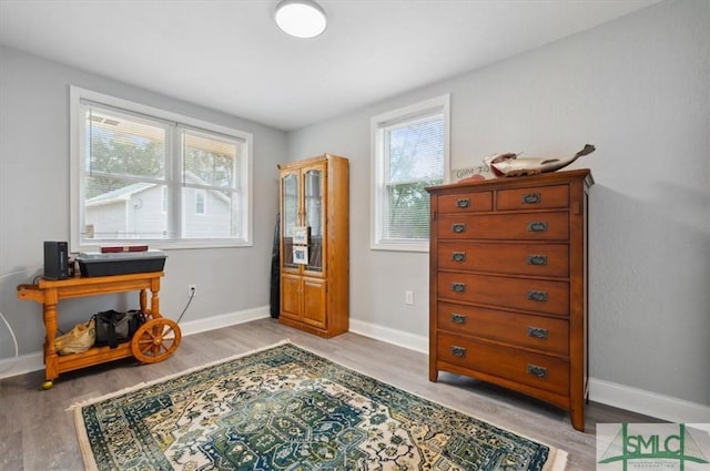 interior space with light wood-type flooring and baseboards