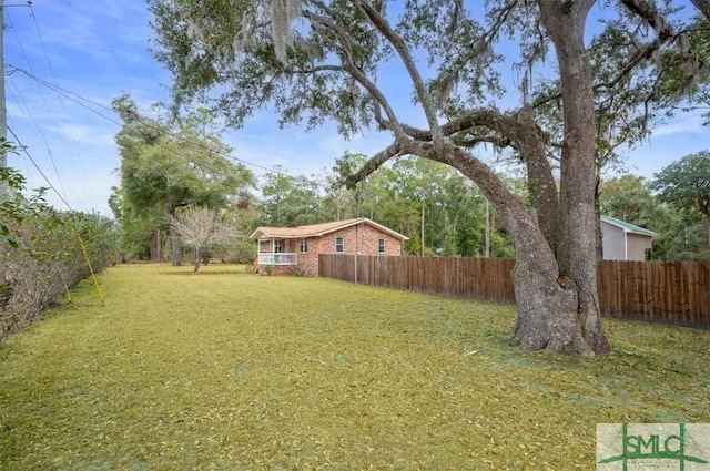 view of yard with a fenced backyard