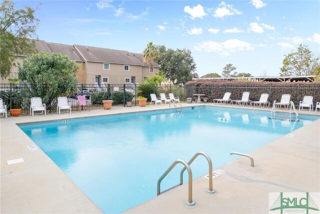 view of swimming pool featuring a patio area