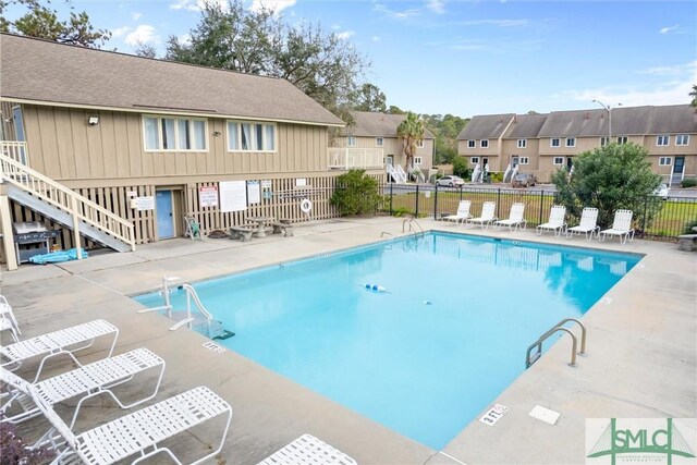 view of swimming pool featuring a patio area