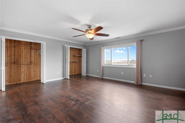 unfurnished bedroom featuring dark hardwood / wood-style flooring, ceiling fan, and crown molding