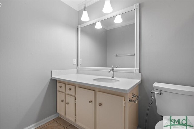 bathroom featuring tile patterned floors, vanity, and toilet