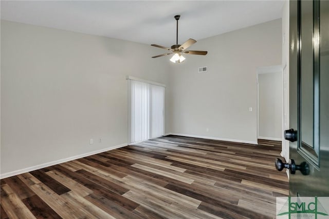 unfurnished room featuring ceiling fan, high vaulted ceiling, and dark hardwood / wood-style floors