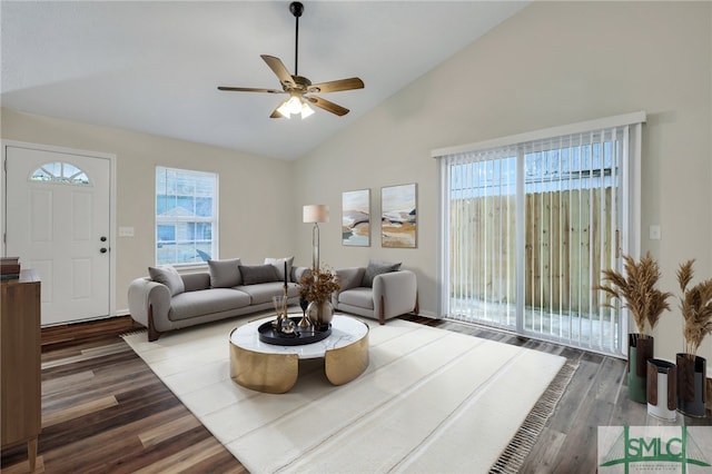 living room with ceiling fan, high vaulted ceiling, and dark wood-type flooring