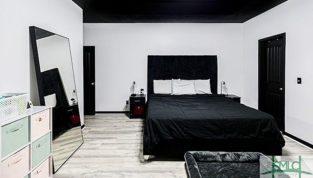 bedroom with light hardwood / wood-style floors