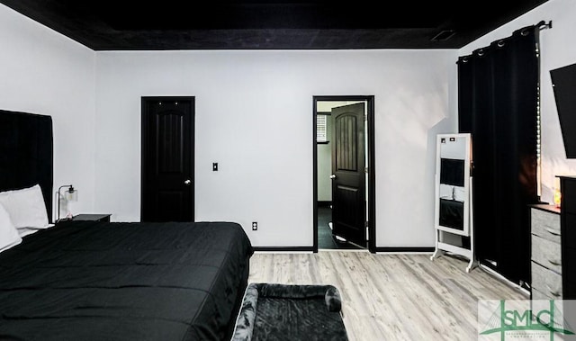 bedroom with light wood-type flooring