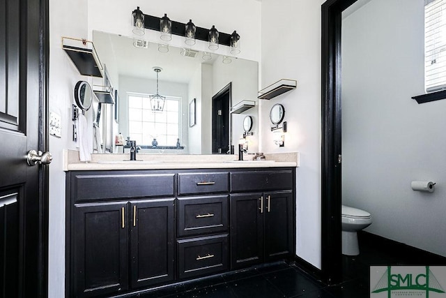 bathroom with vanity and toilet