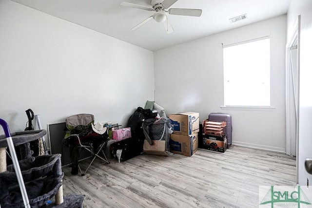 interior space with light hardwood / wood-style flooring and ceiling fan