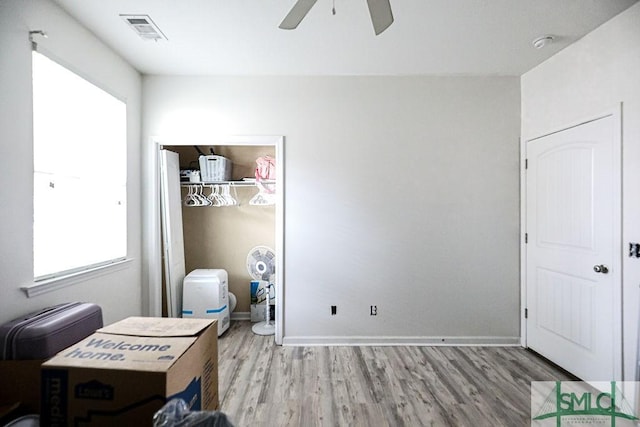 interior space with ceiling fan and light wood-type flooring