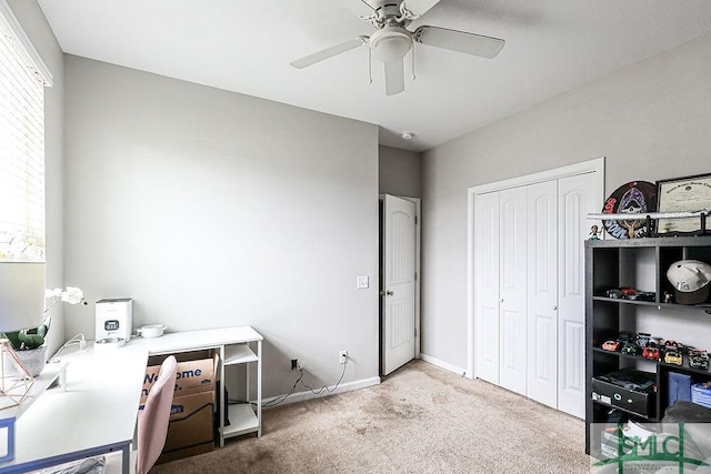 carpeted office with ceiling fan