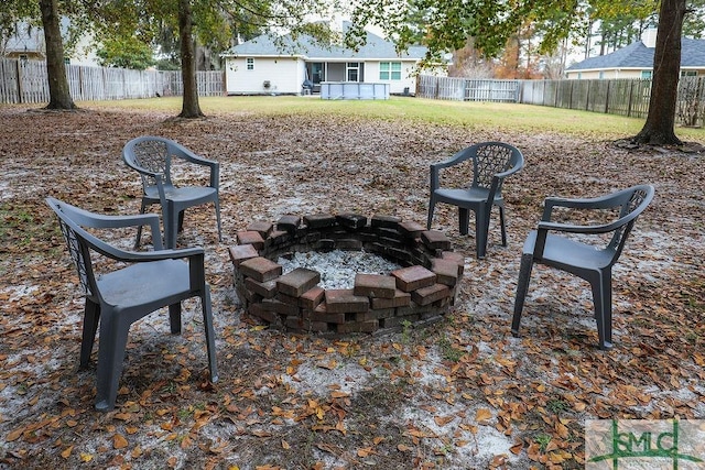 view of yard featuring an outdoor fire pit