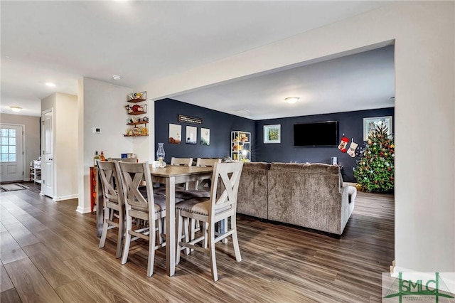 dining area with wood-type flooring