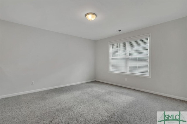 spare room featuring carpet flooring