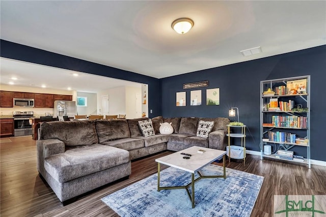 living room featuring dark hardwood / wood-style flooring