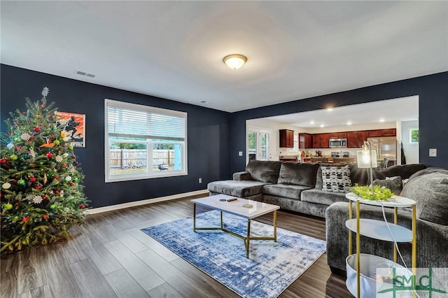 living room with dark hardwood / wood-style floors