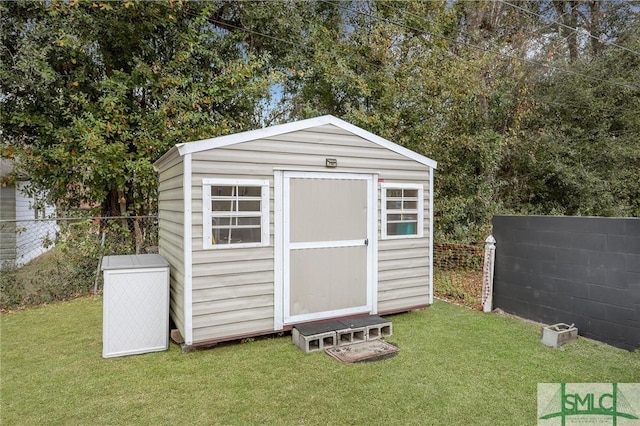 view of outdoor structure with a lawn