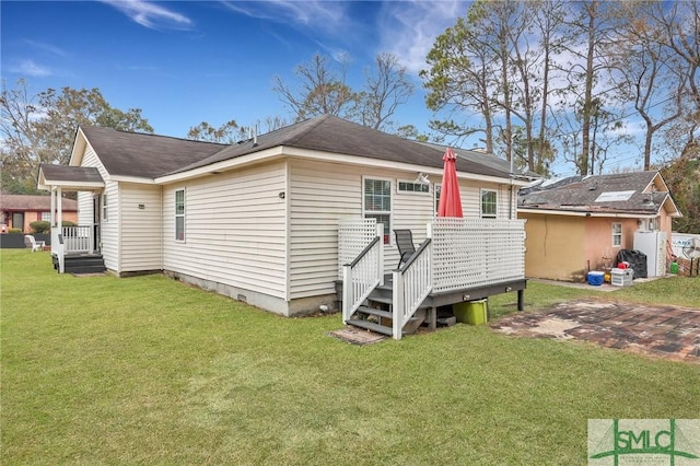 back of house featuring a yard and a patio