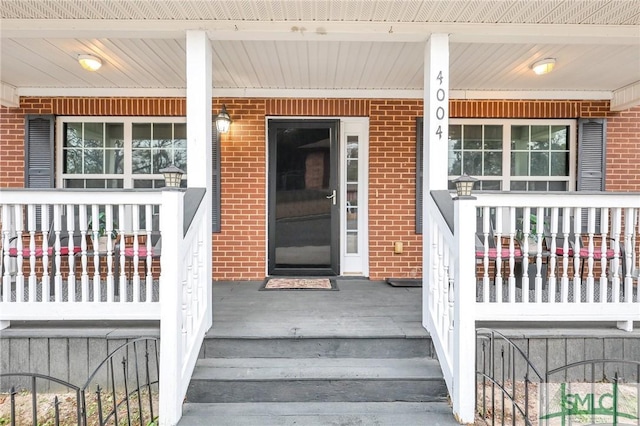 property entrance featuring covered porch