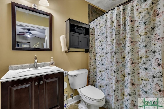 bathroom with vanity, ceiling fan, toilet, a textured ceiling, and walk in shower