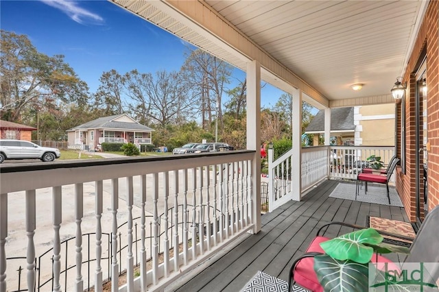 wooden terrace featuring a porch