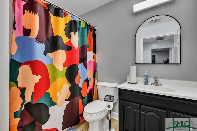 bathroom with tile patterned floors, a shower with curtain, a textured ceiling, vanity, and toilet