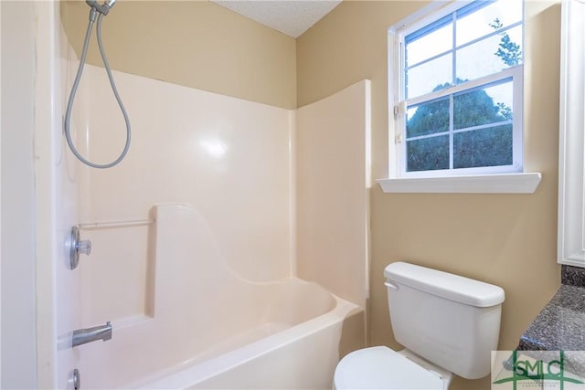 bathroom with toilet and shower / bathtub combination