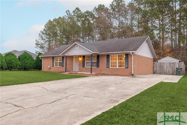 single story home featuring a front lawn