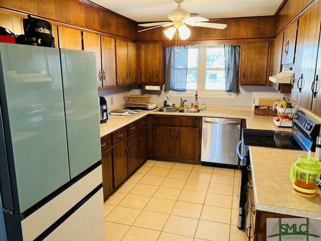 kitchen featuring sink, electric stove, light tile patterned floors, dishwasher, and fridge