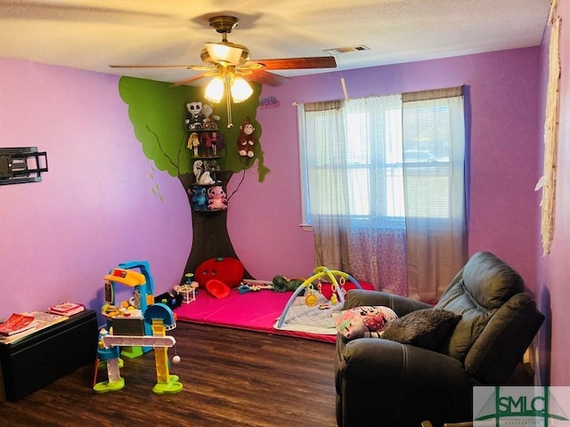 bedroom featuring hardwood / wood-style floors and ceiling fan