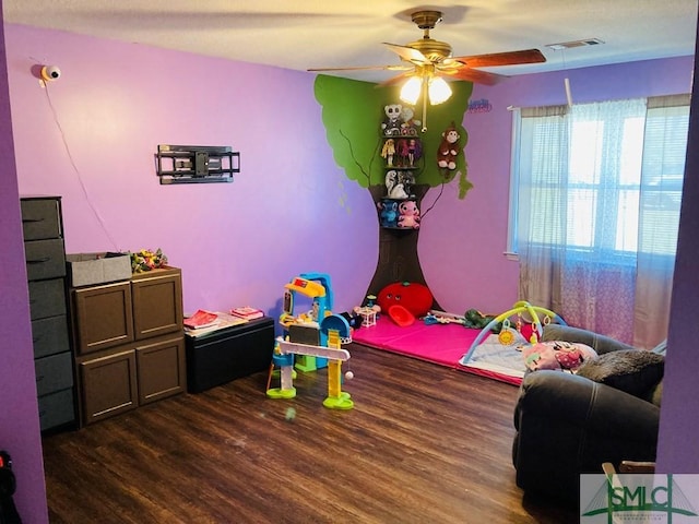 bedroom with ceiling fan and dark wood-type flooring