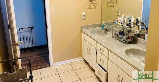 bathroom with tile patterned flooring and vanity