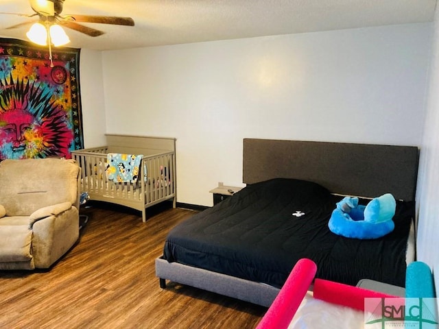 bedroom with wood-type flooring and ceiling fan