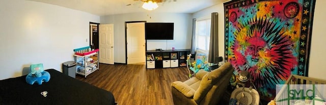 living room featuring dark hardwood / wood-style floors and ceiling fan