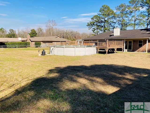 view of yard featuring a swimming pool side deck