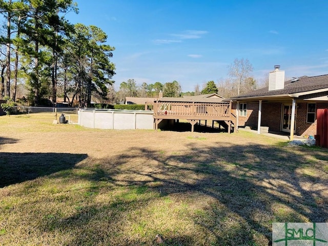 view of yard featuring a pool side deck