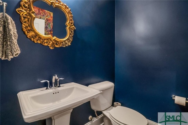 bathroom with sink and toilet