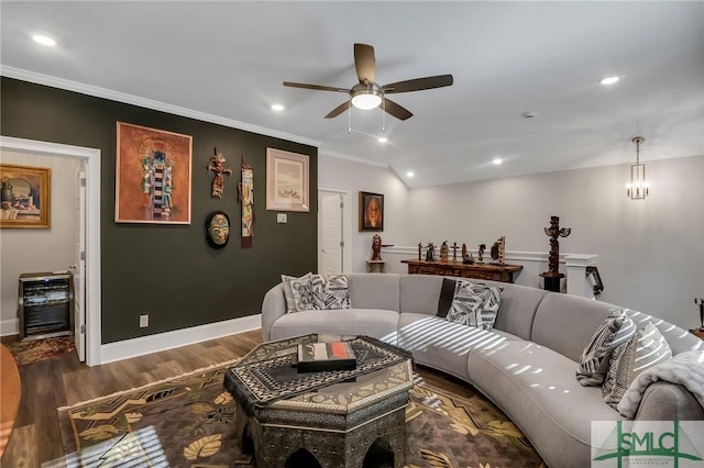 living room featuring ceiling fan, dark hardwood / wood-style flooring, and crown molding