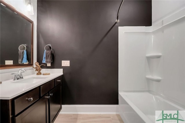 bathroom with vanity and shower / bathing tub combination