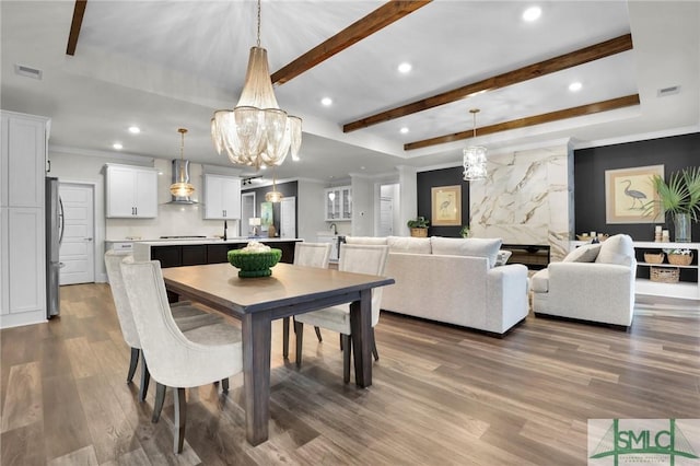 dining area with dark wood-type flooring, beam ceiling, visible vents, and recessed lighting