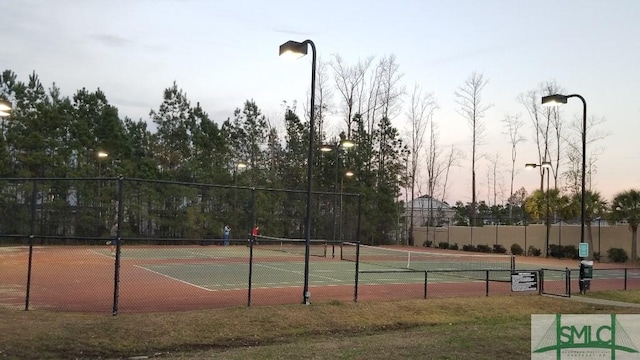 view of tennis court with fence