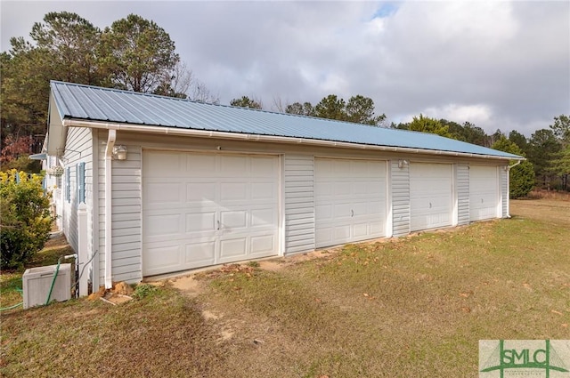 garage featuring a yard