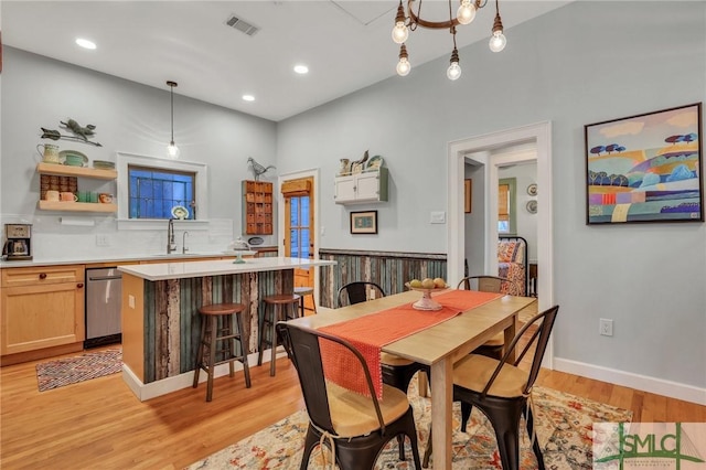 dining area featuring light hardwood / wood-style flooring and sink