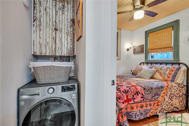 bedroom featuring washer / clothes dryer and ceiling fan